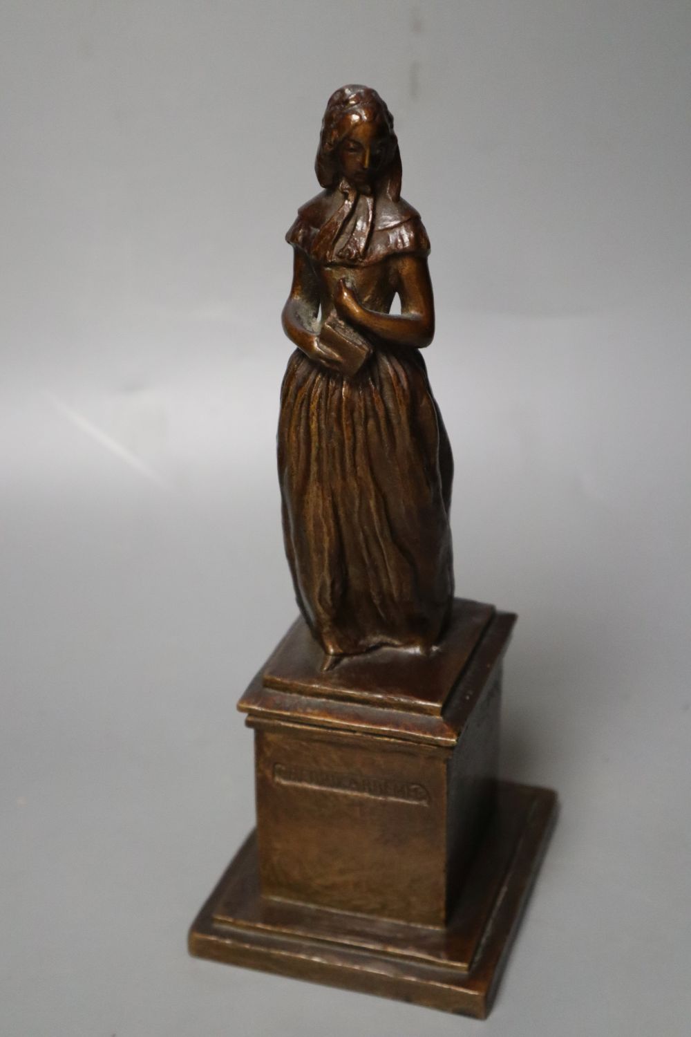 After Herman Bergman. A bronze statuette of Swedish author Frederika Bremer, 24cm